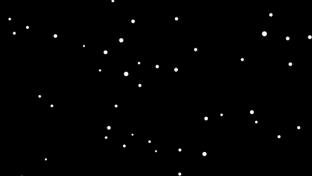 舞い落ちる円形の雪の動画素材です。